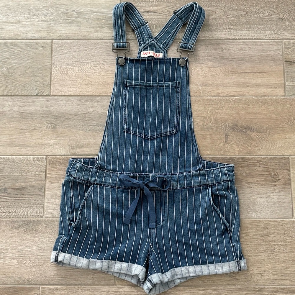 Blue and white striped denim overalls